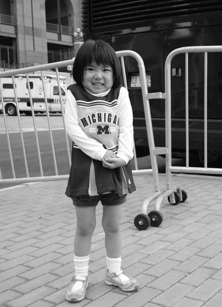 Fan in front of the Michigan Stadium